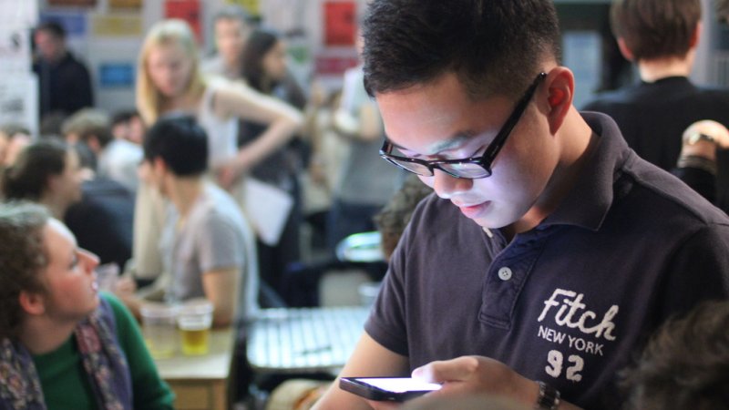 a student giving feedback on his mobile