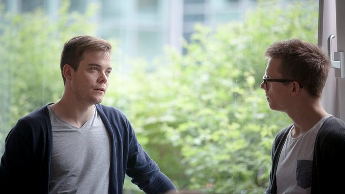 Students talking at window