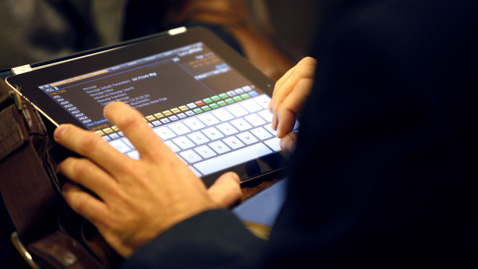 Man typing on iPad