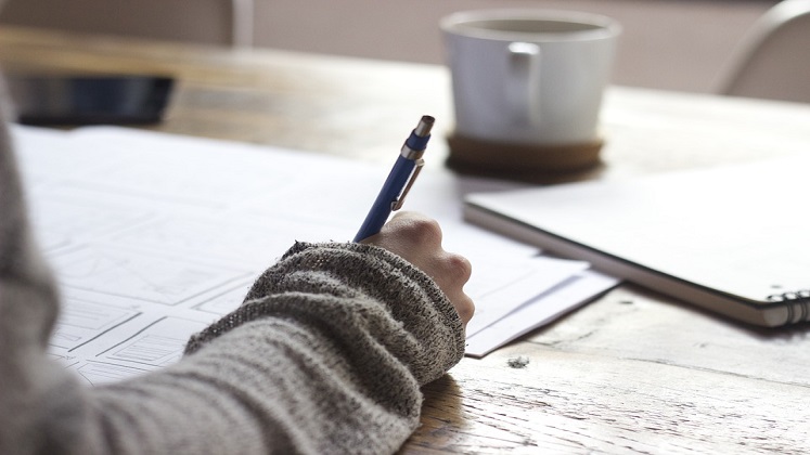 16x9-female-writing